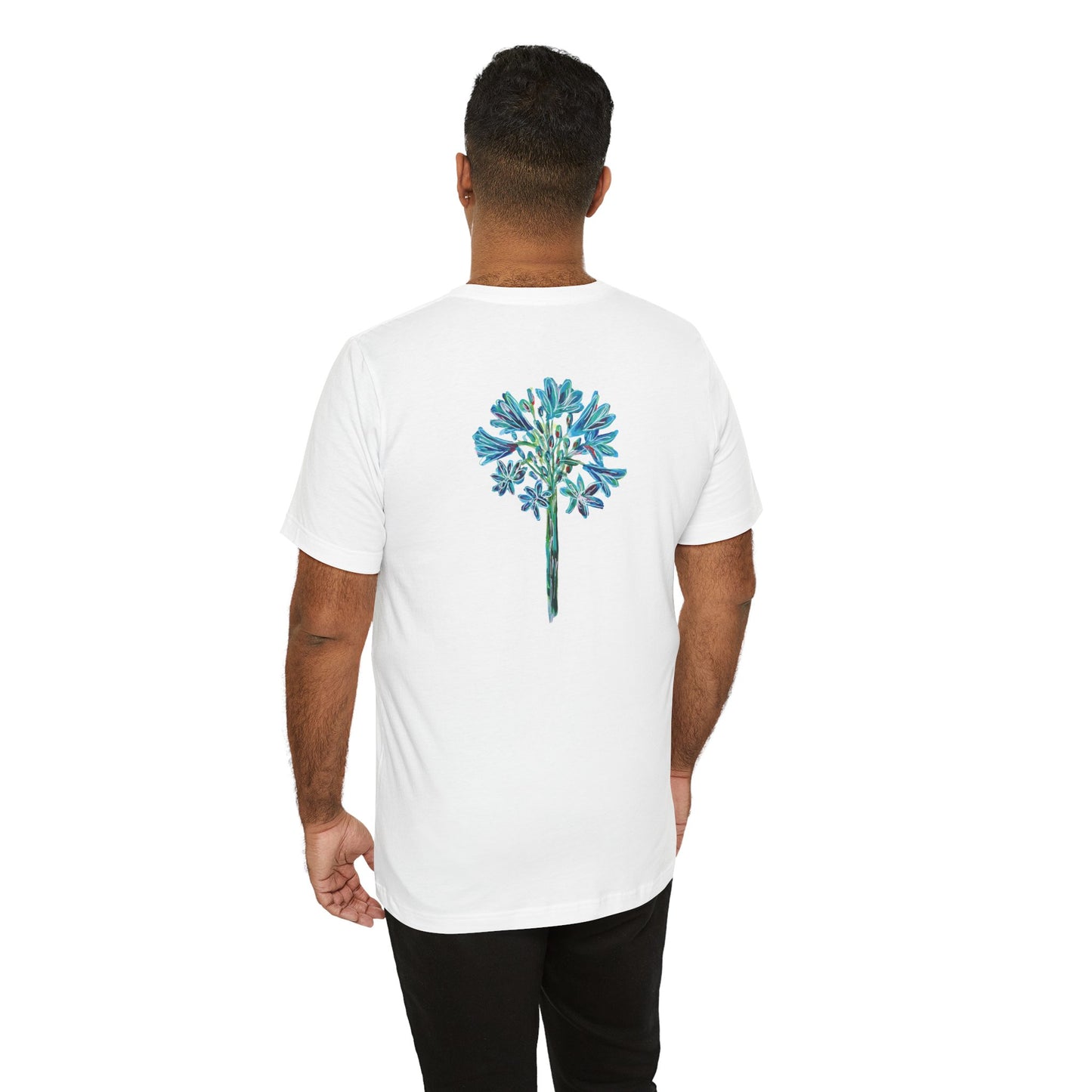 Man wearing a white t-shirt with painted allium flower on the back, standing against a white background