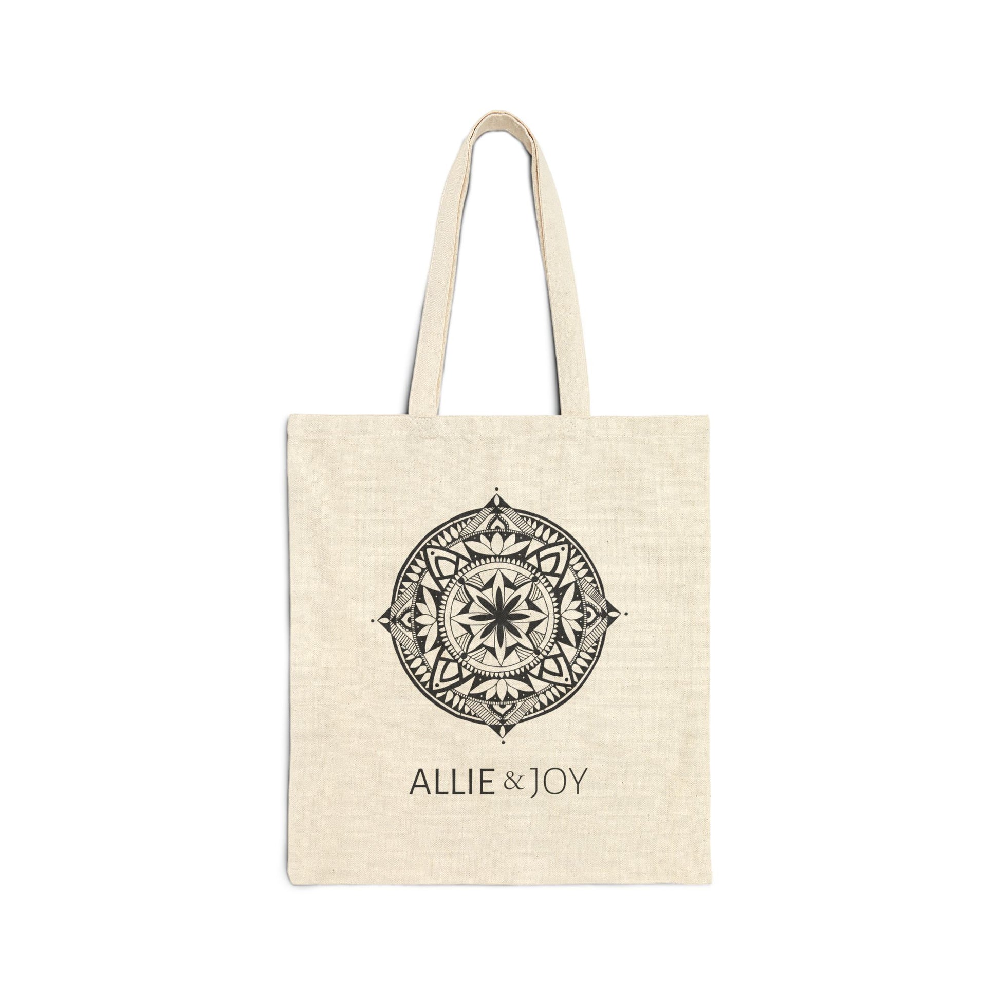 Beige tote bag with decorative mandala emblem and 'Allie & Joy' logo text on a white background